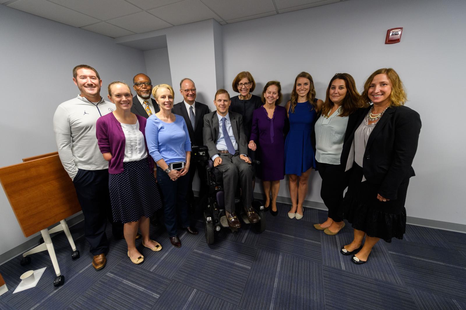 Taylor Price (B'10, G'12) (center) joins President John J. DeGioia and staff members from ARC and Student Affairs at the Fall 2018 ARC dedication ceremony.