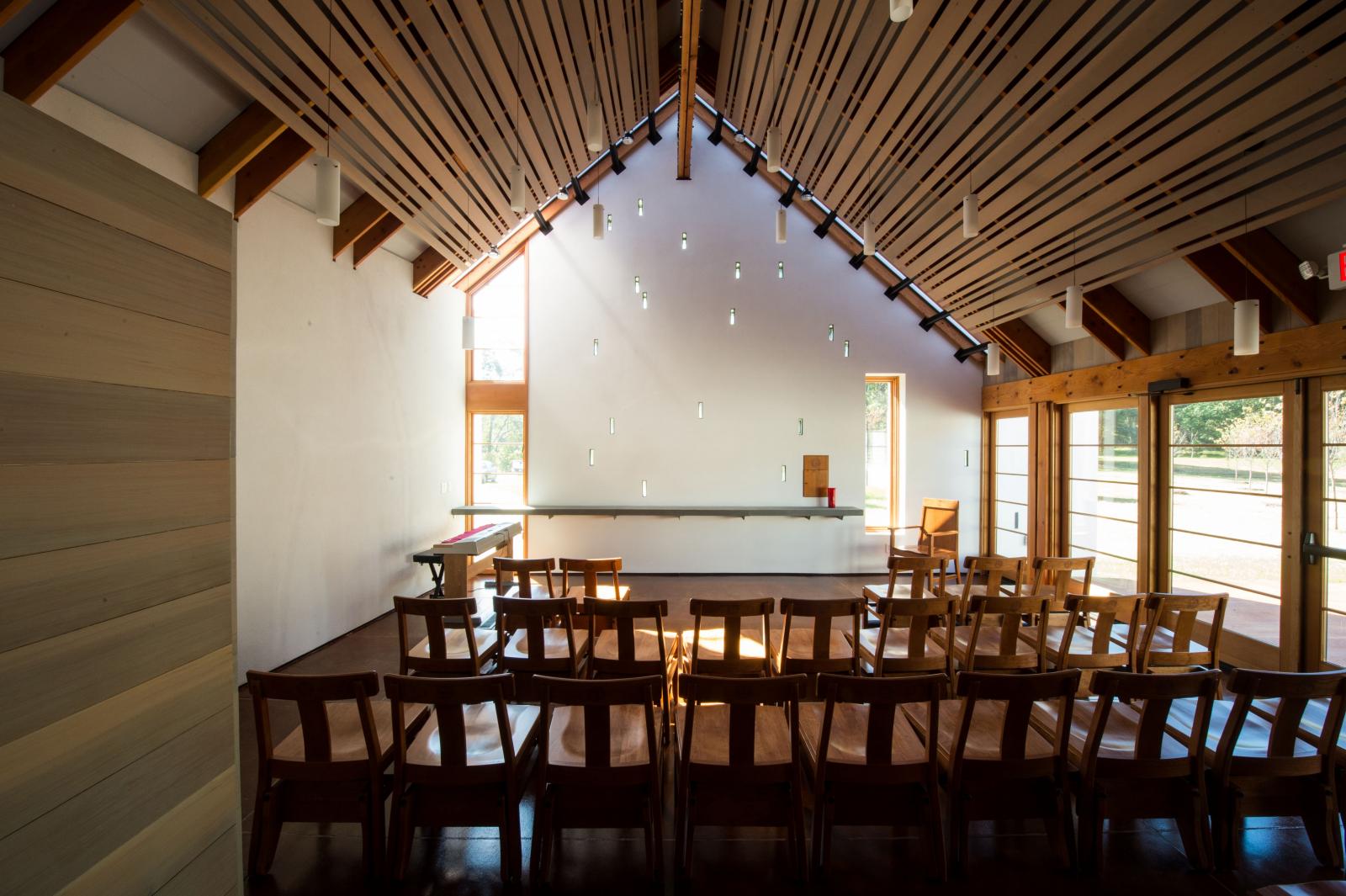 The sun-lit interior of the Calcagnini Contemplative Center chapel