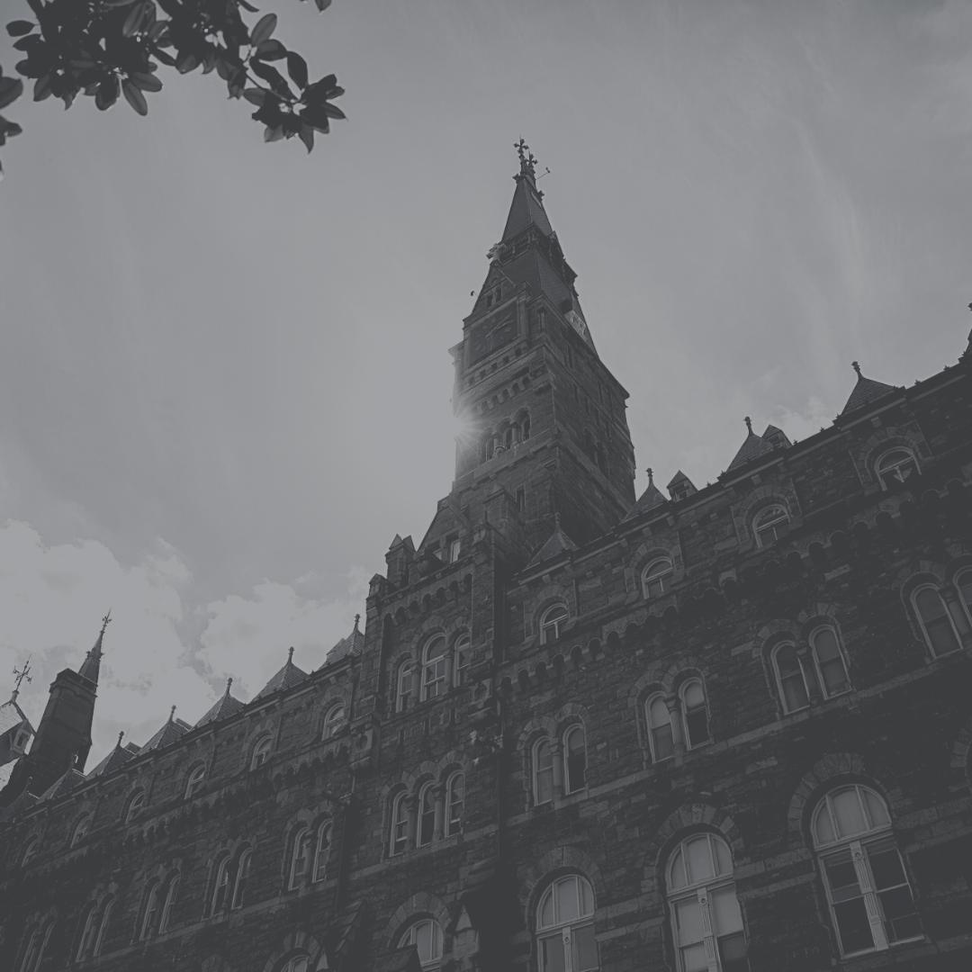 Healy Hall with the sun behind its tower