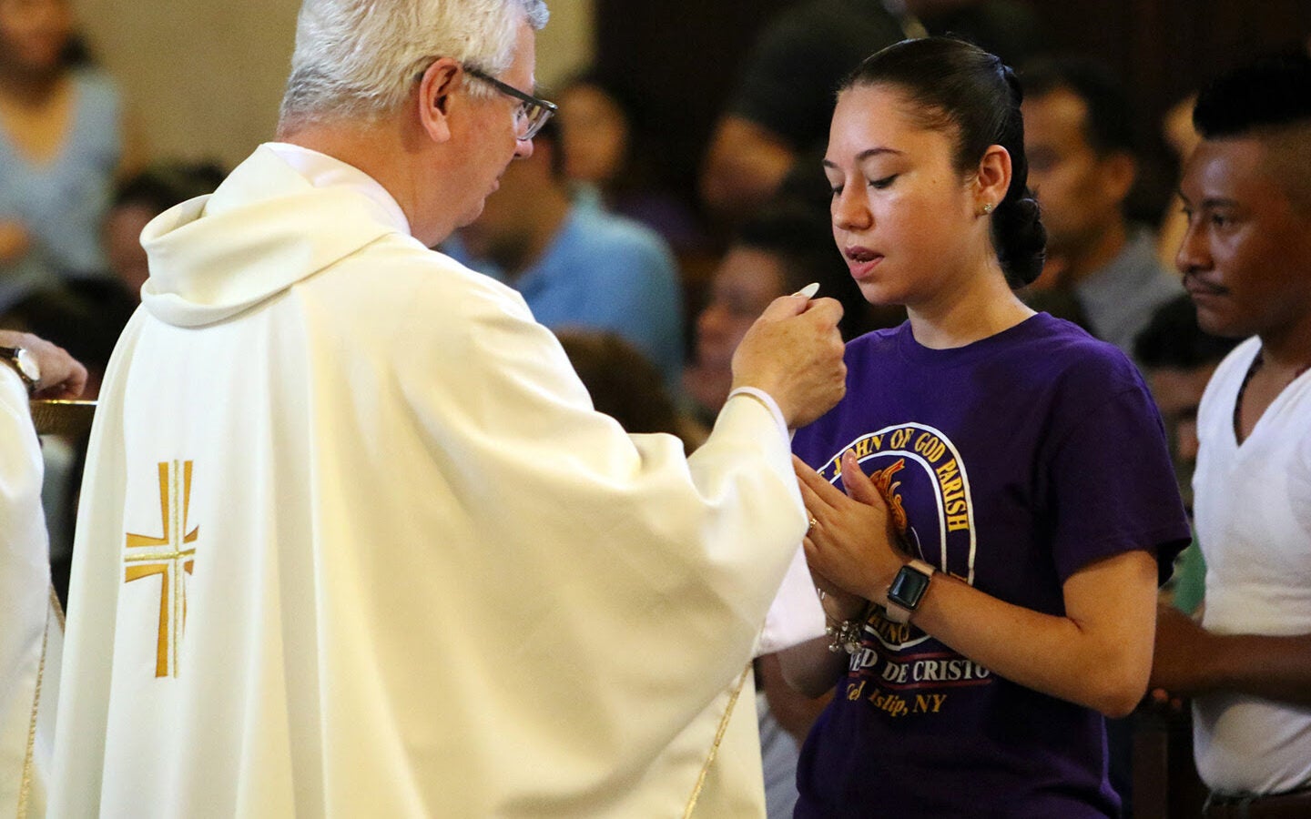 Young Woman Receiving Communion