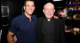 alumni posing with father something