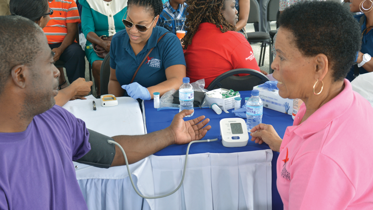 nurses monitoring people's blood pressure