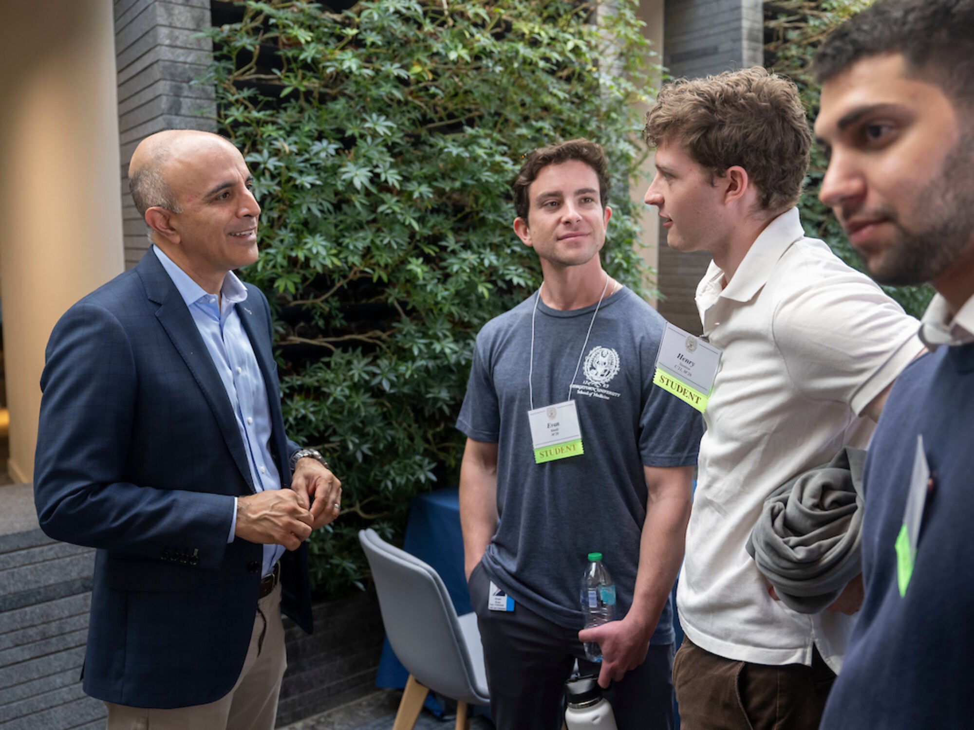 students talking with doctor