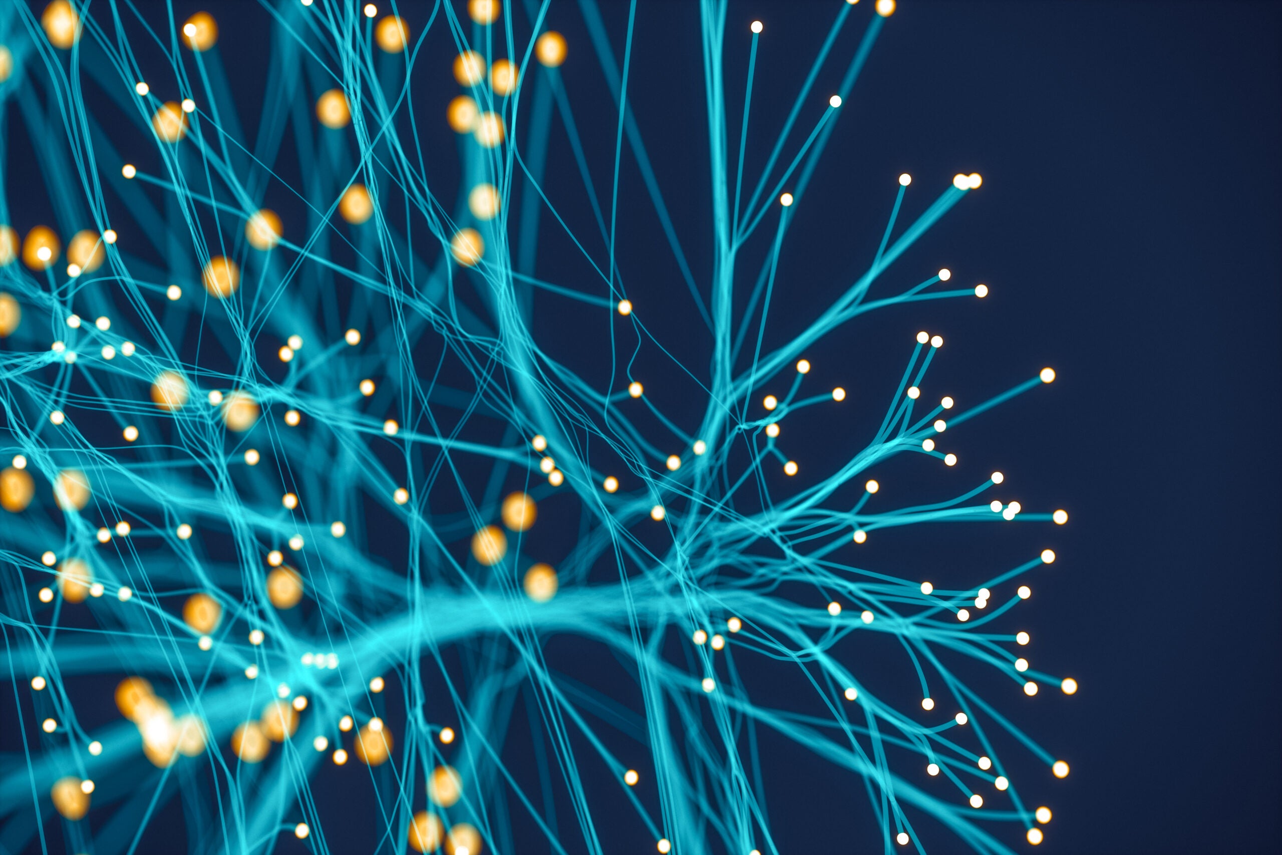 a teal network of electric fibers against a navy background. Photo: iStock
