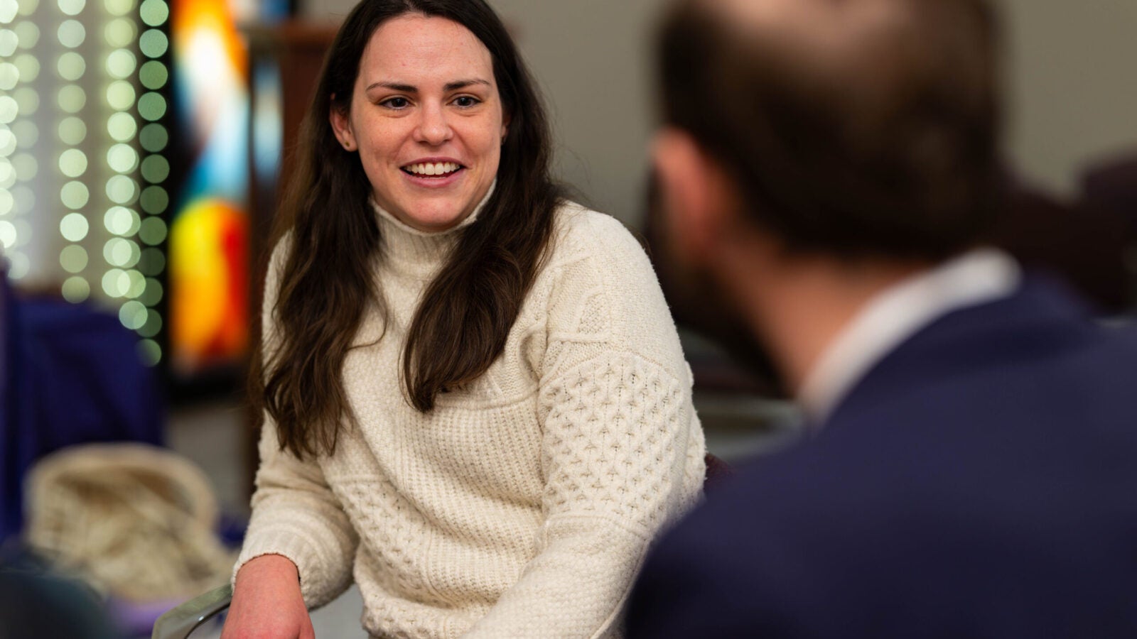 Anna Harty talking with someone and smiling