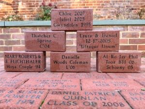 Examples of personalized bricks in the Alumni House Courtyard