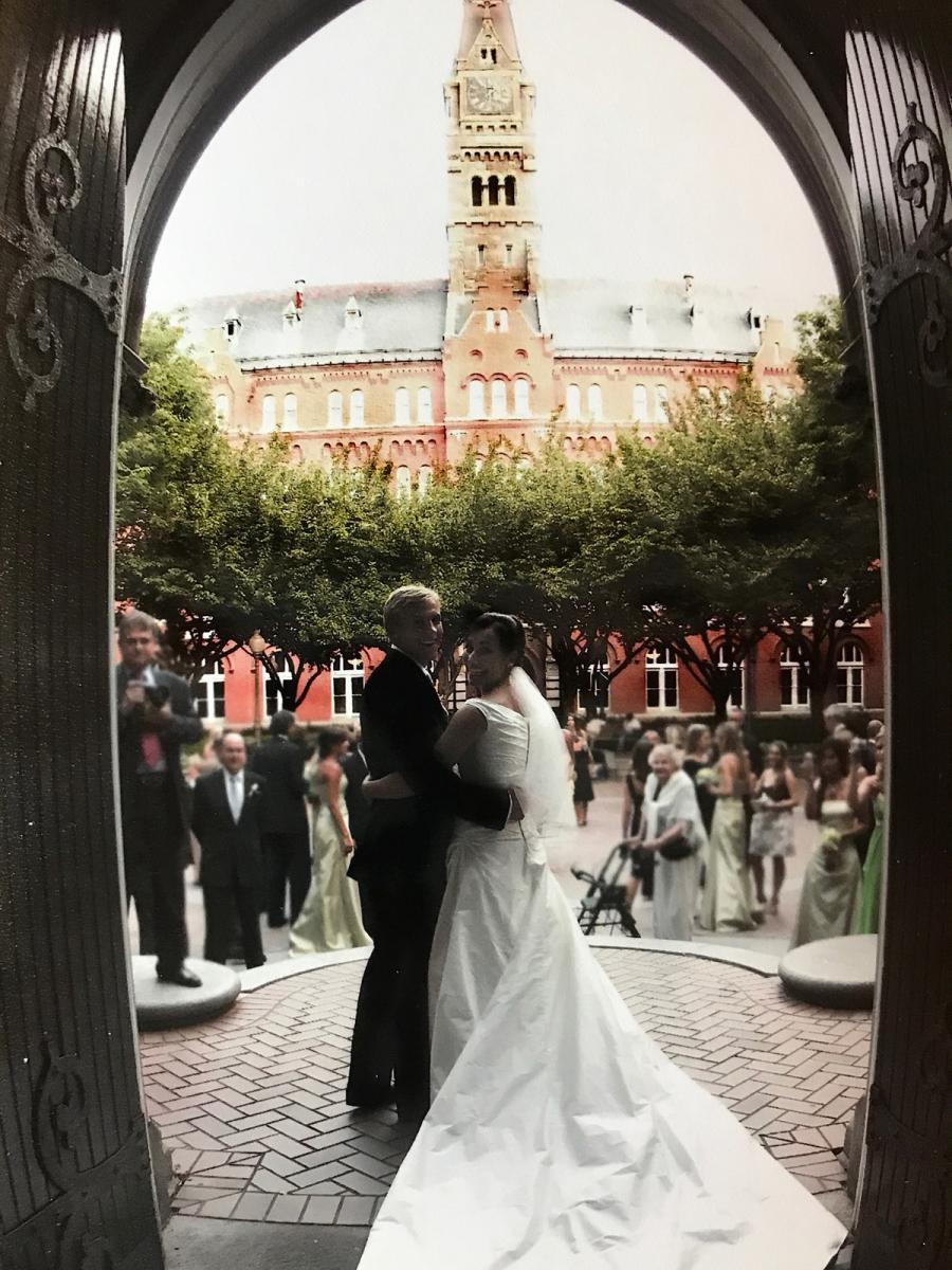 Mark and Giulia look back at the camera in Dahlgren Chapel from just outside the church on their wedding day.